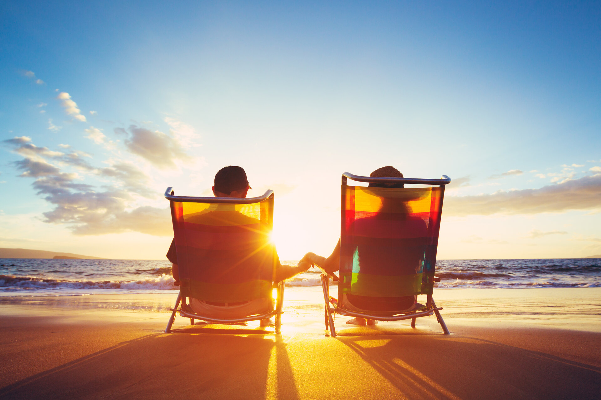 couple sitting in chairs on daytona beach