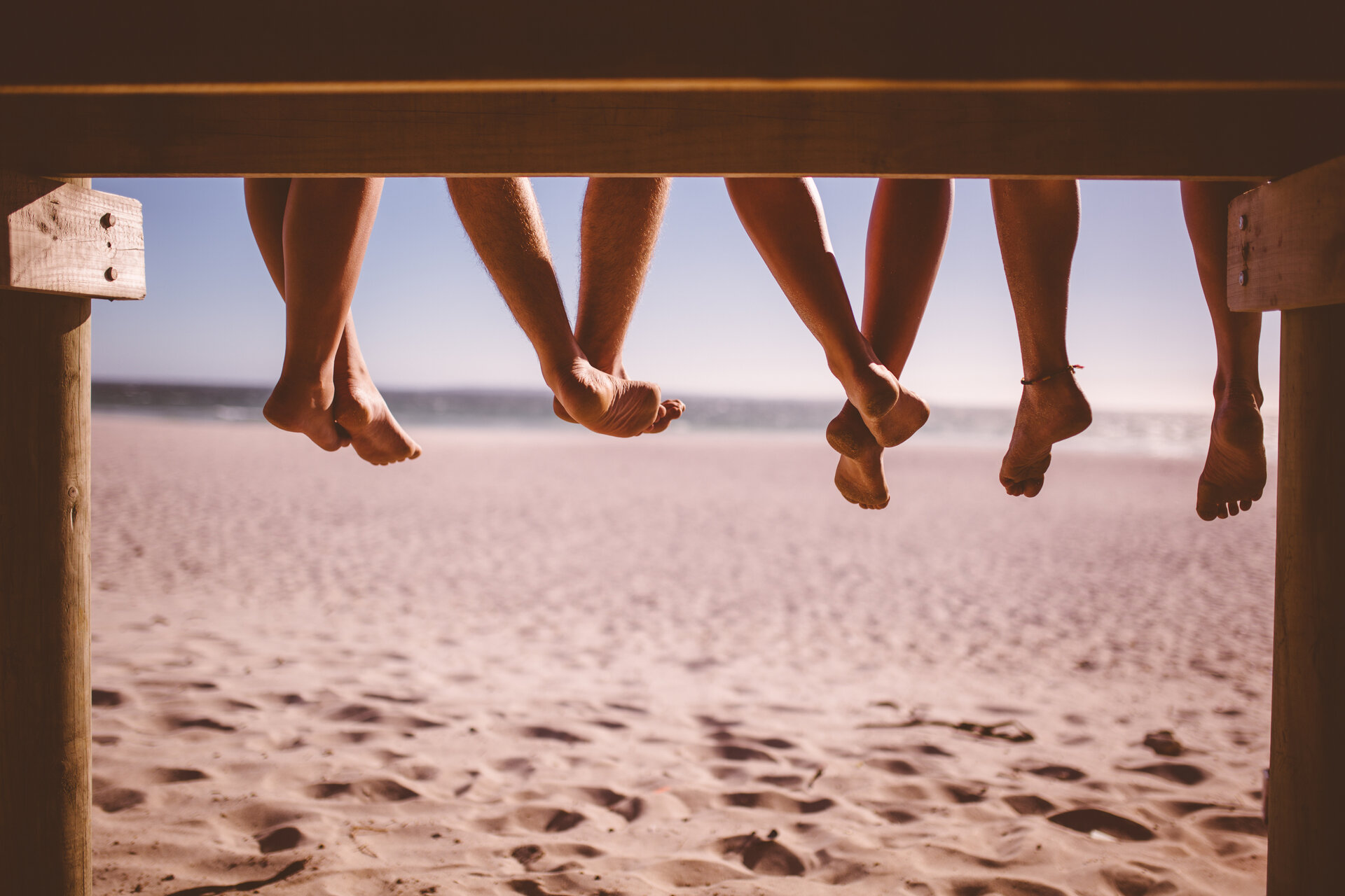 People sitting on a dock at Daytona Beach