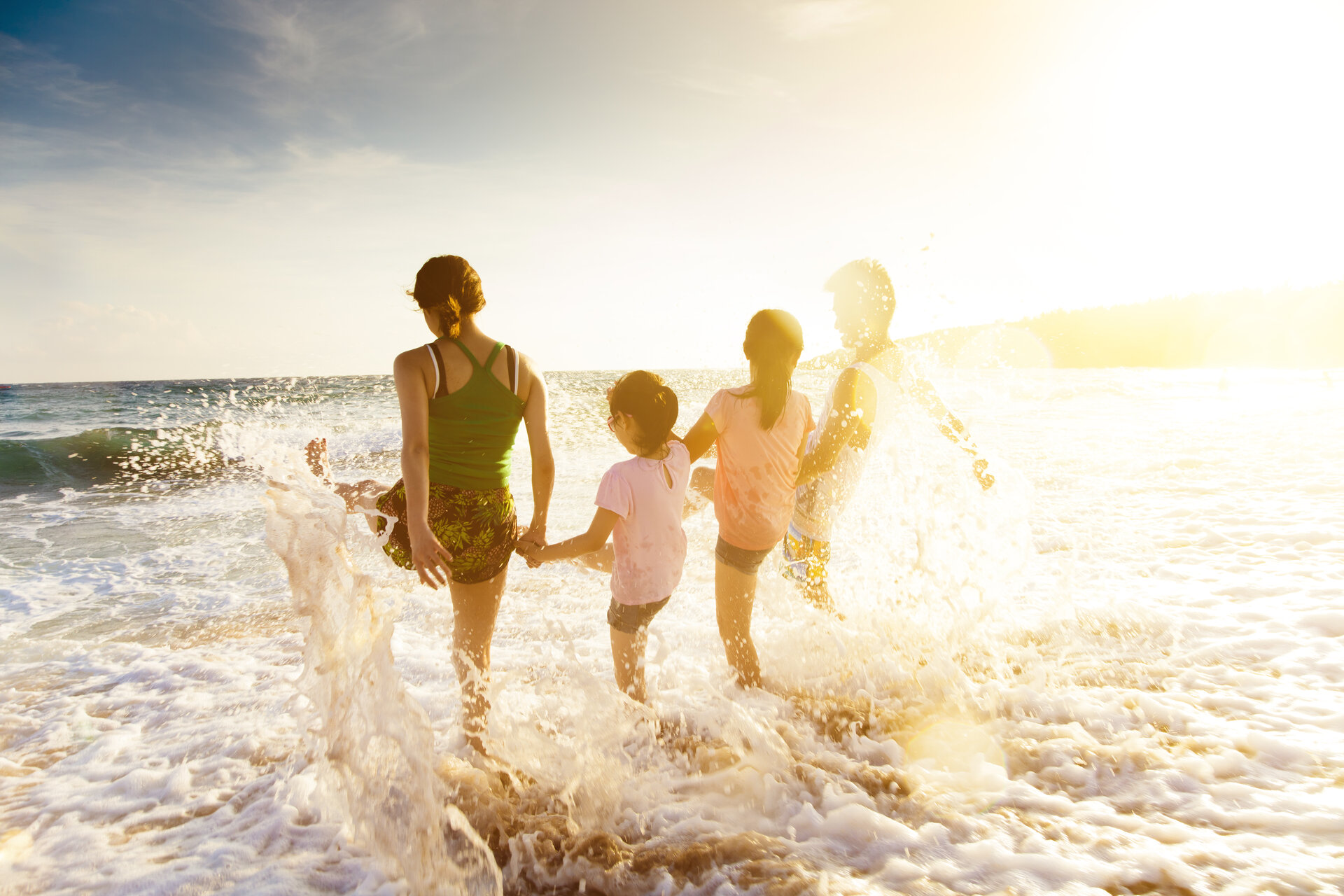 Family on Daytona Beach during sunset